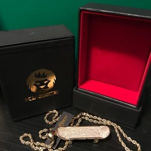 Gold skateboard necklace